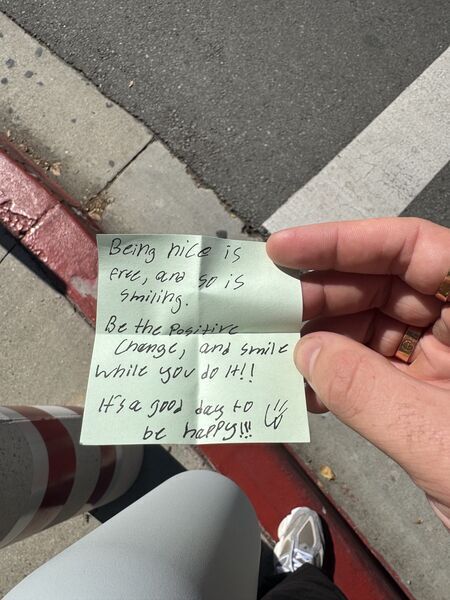 Handwritten sticky note with words of encouragement